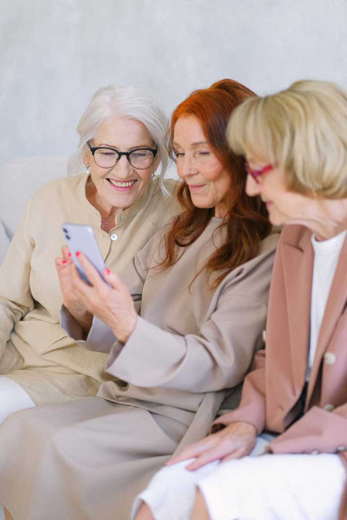 three-senior-women-calling-phone